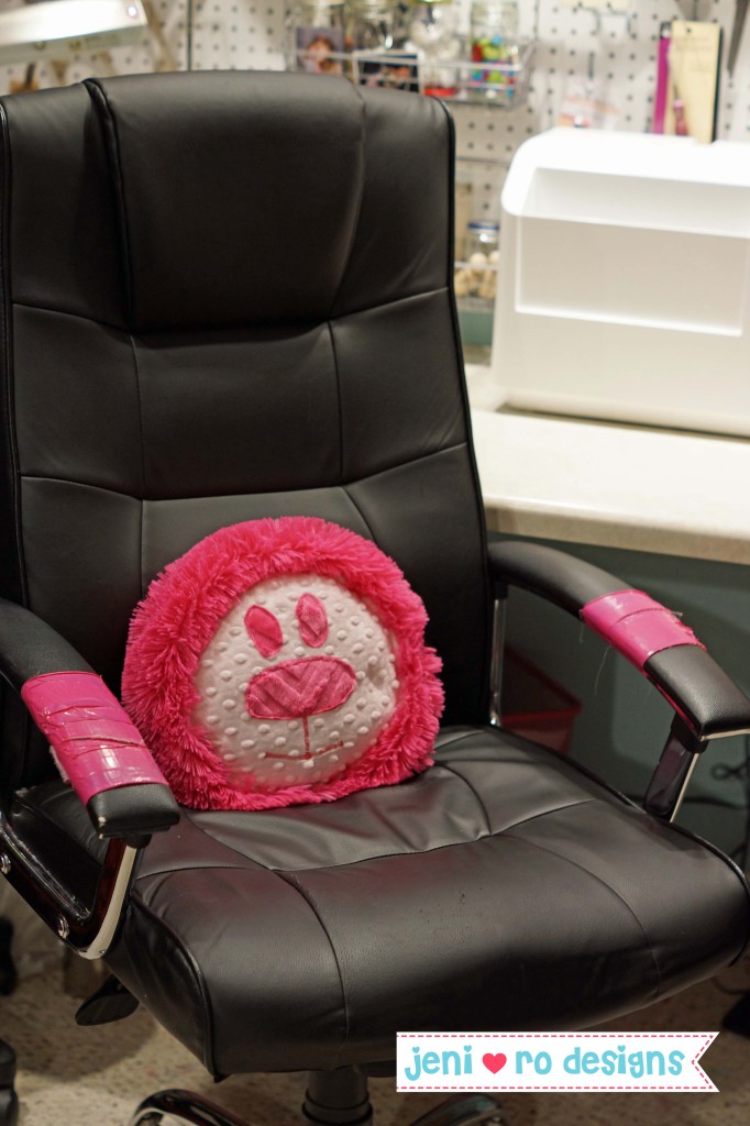 pink lion in chair