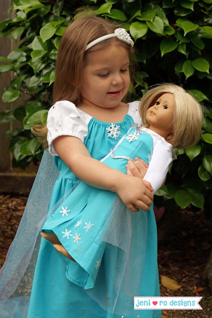 A looking at ag doll in elsa dress
