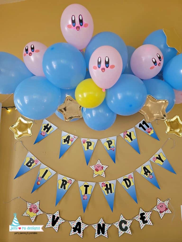 kirby birthday party banner and balloons